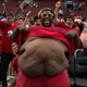 Illustration for article titled TNT Should Not Have Allowed This Morbidly Obese Sixers Fan To Participate In The Shirt-Off